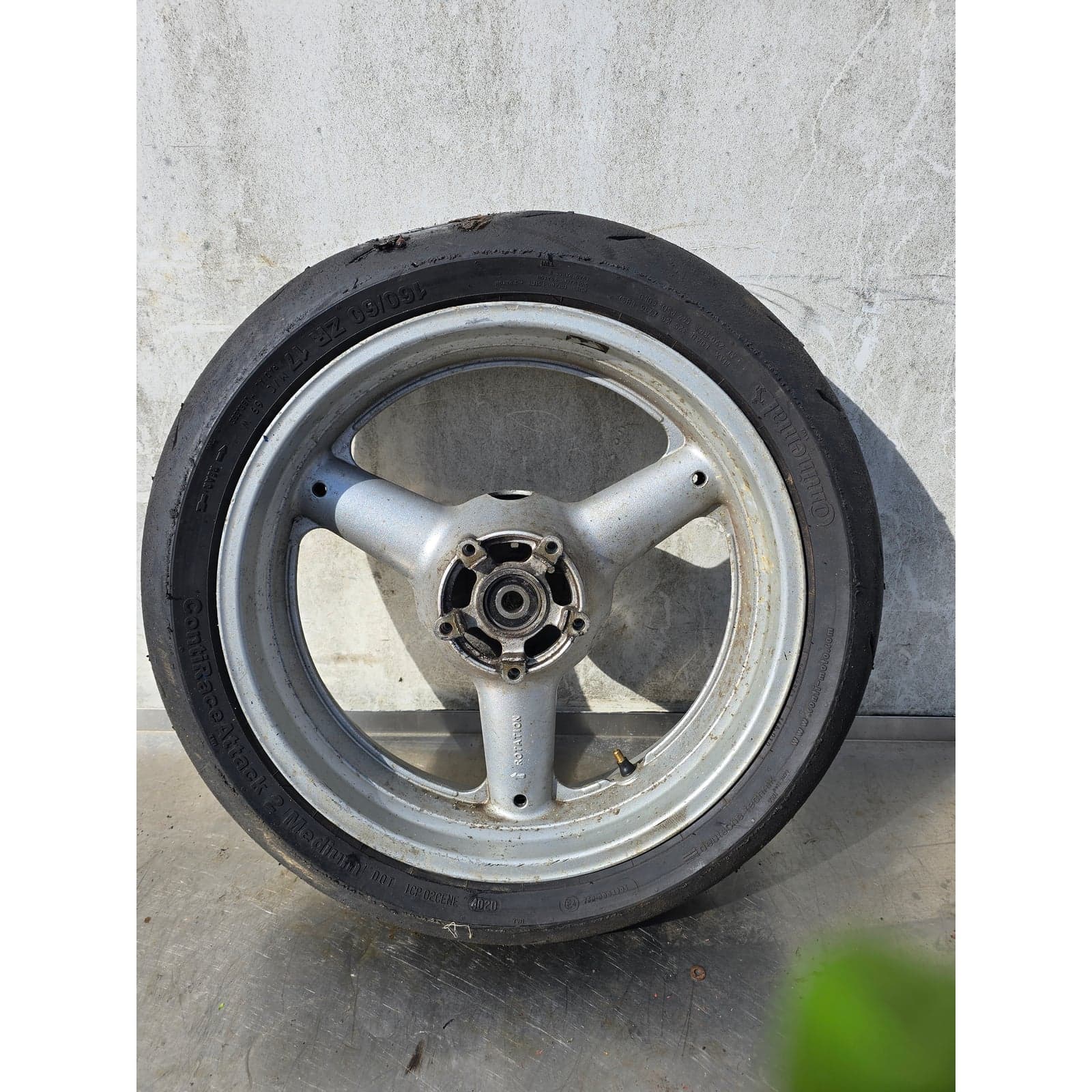Full view of Suzuki SV650 rear wheel and Continental tyre from side