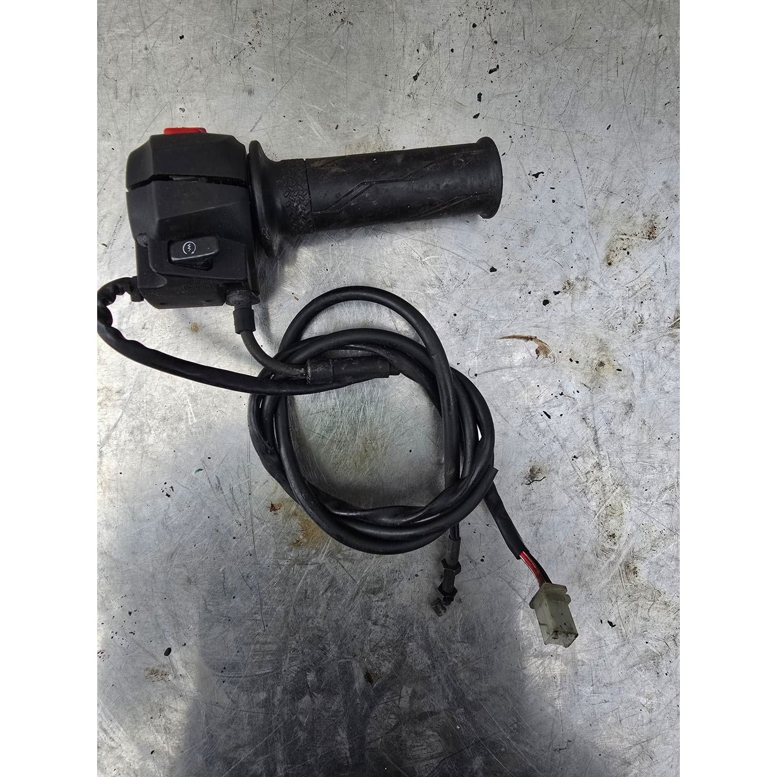 Top-down view of the right-hand handlebar switchgear assembly and integrated throttle.