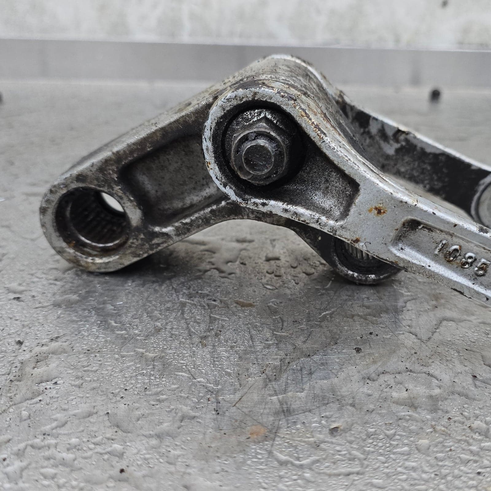 Angled top view of the complete Kawasaki Uni-Trak linkage assembly