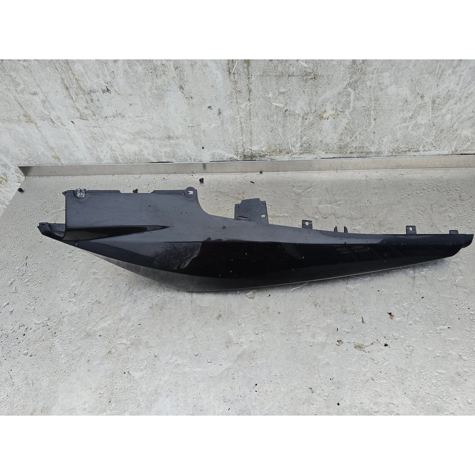 Full length exterior view of the left-hand side tail fairing panel, showing its sleek form.