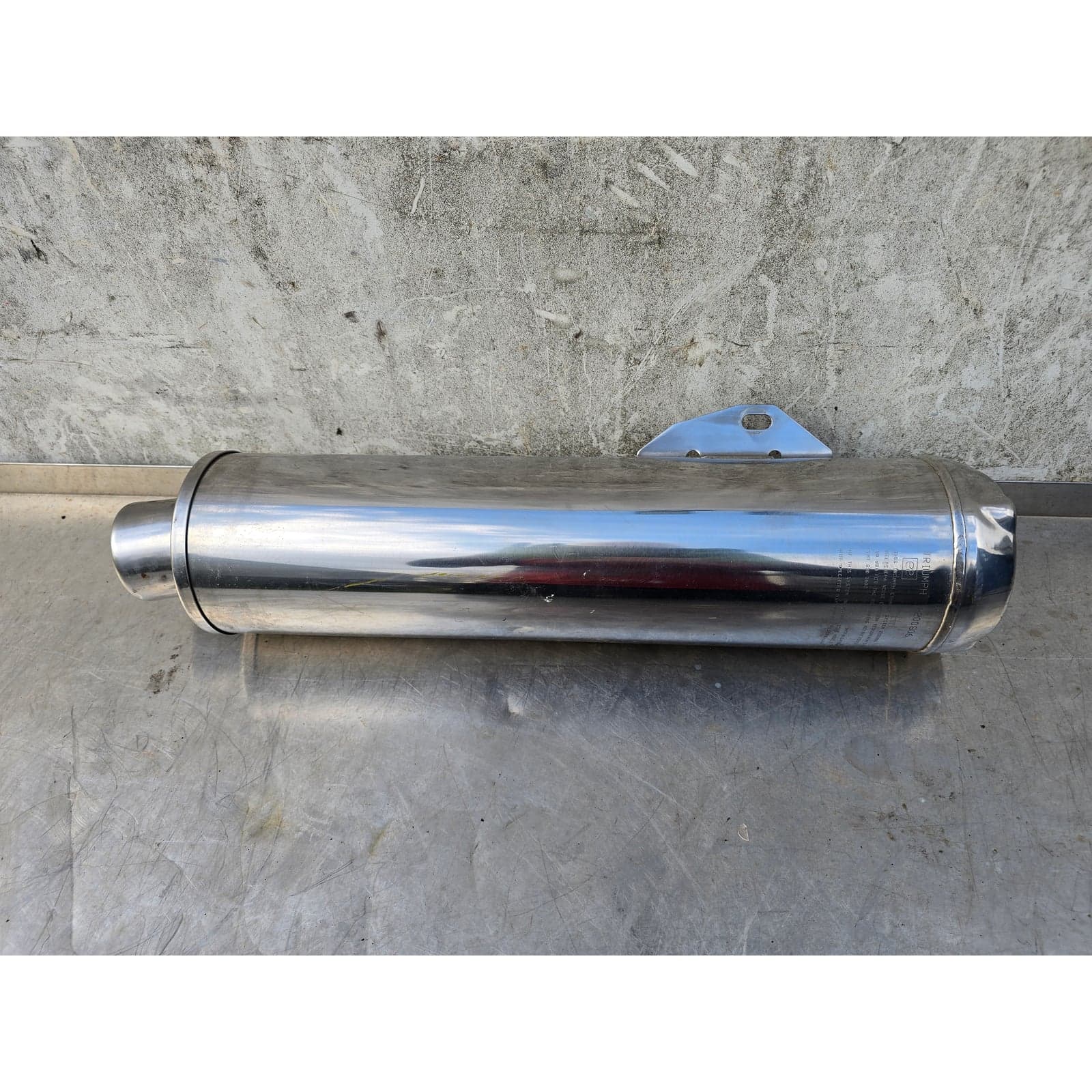 Full side view of the Triumph stainless steel exhaust silencer.