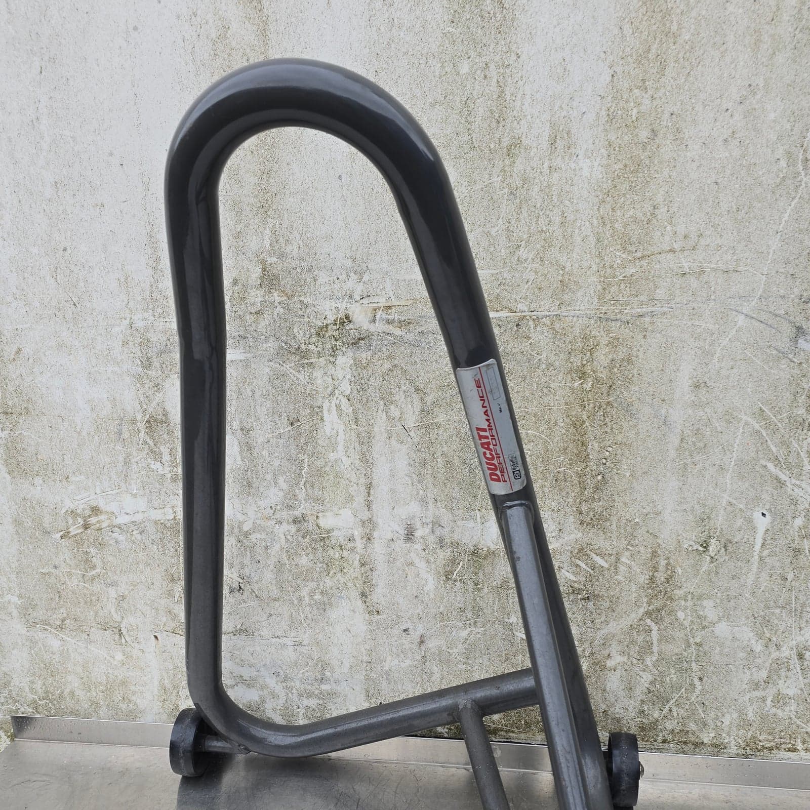 Front view of the Ducati Performance paddock stand with branding