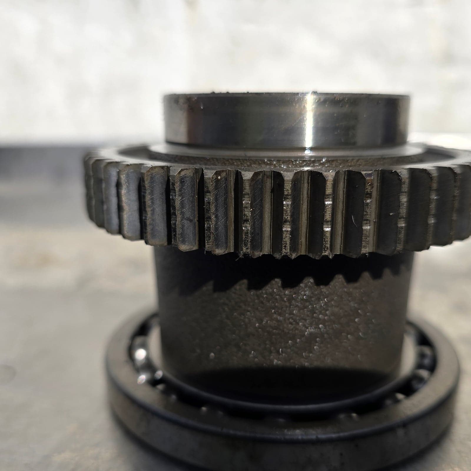 Close-up of the gear teeth and central shaft of the middle gear component.