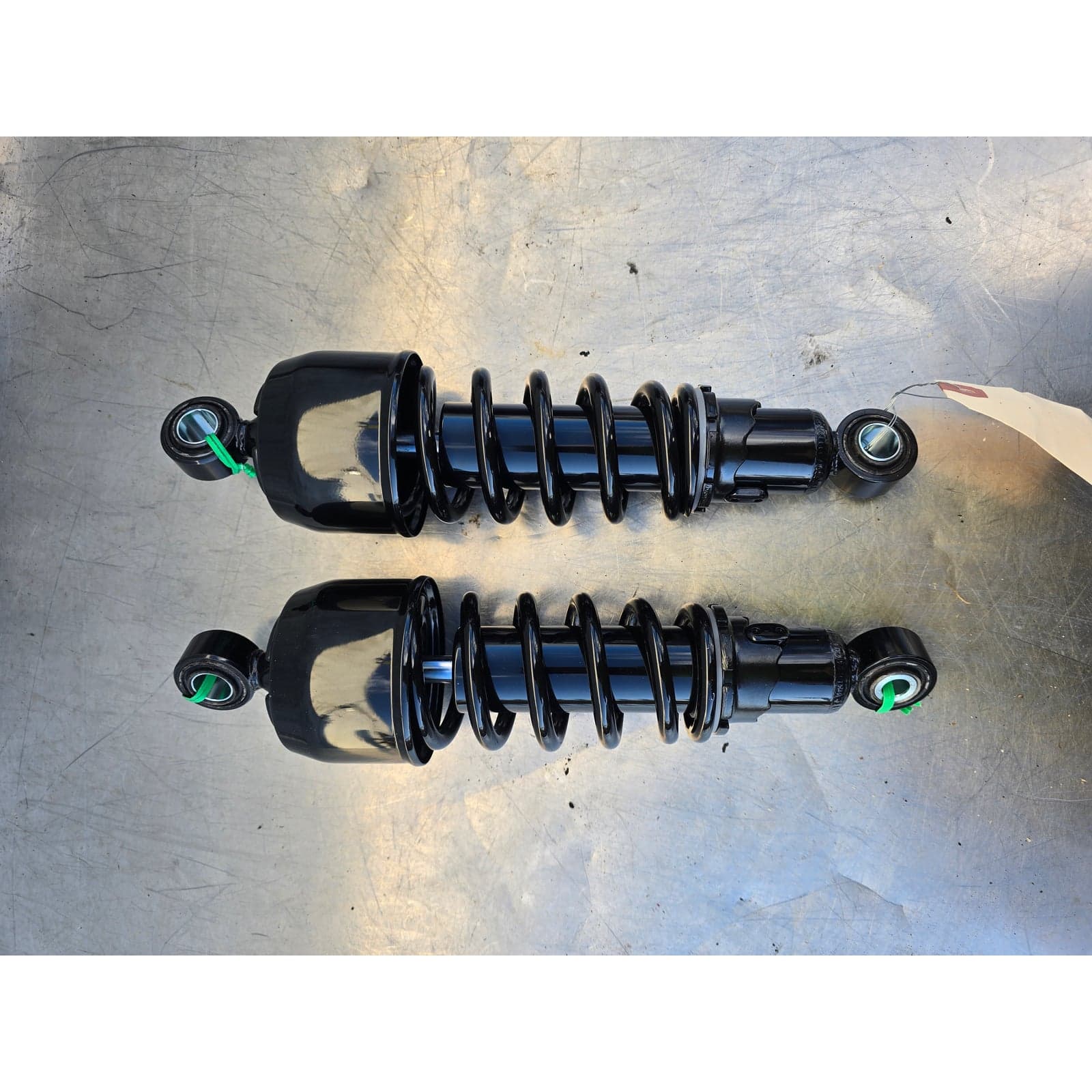Forsa rear shock absorbers for motorcycle, showing both units