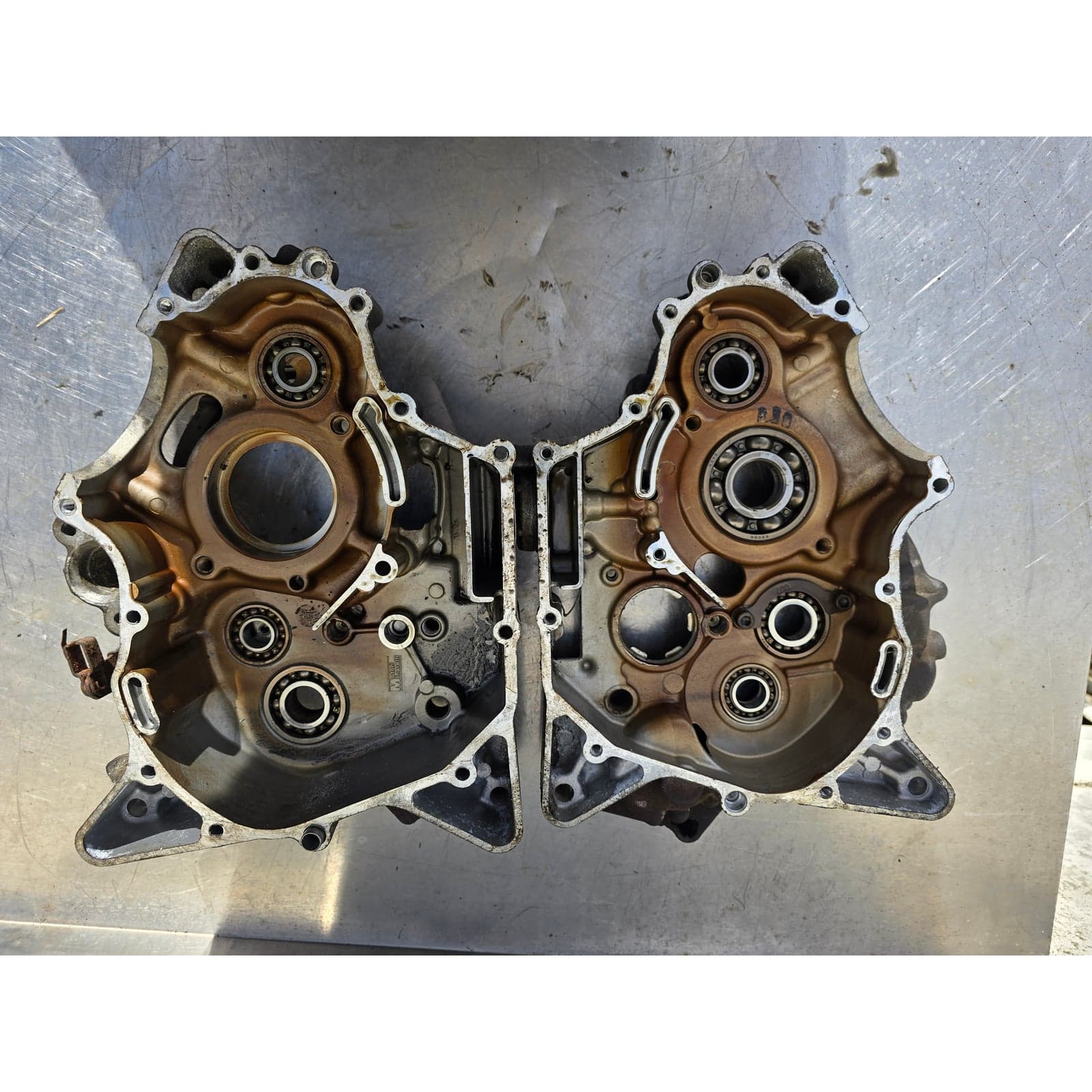 Both Yamaha YZF-R125 engine crankcase halves laid open, showing complete internal layout.